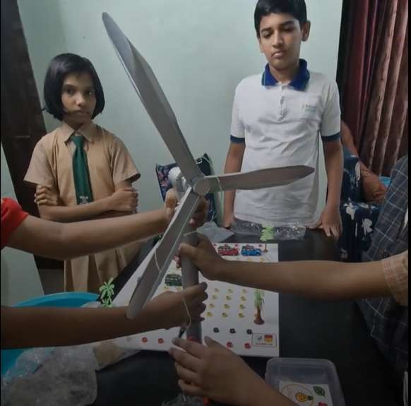 Students building a wind turbine with SparkBoard